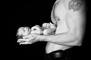 Dad holding newborn baby